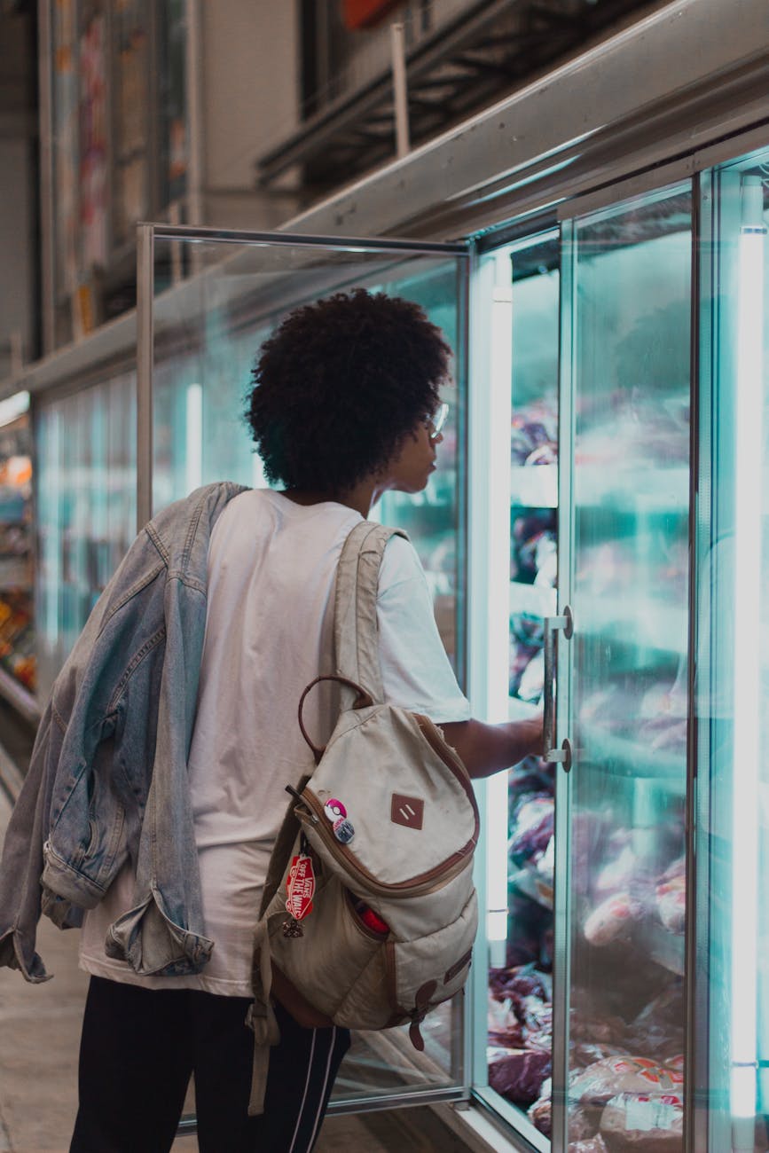 man opening refrigerator
